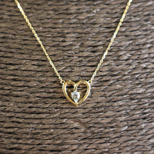 18KT geel gouden ketting met hartvormig tussenstuk en topaas 065763/T