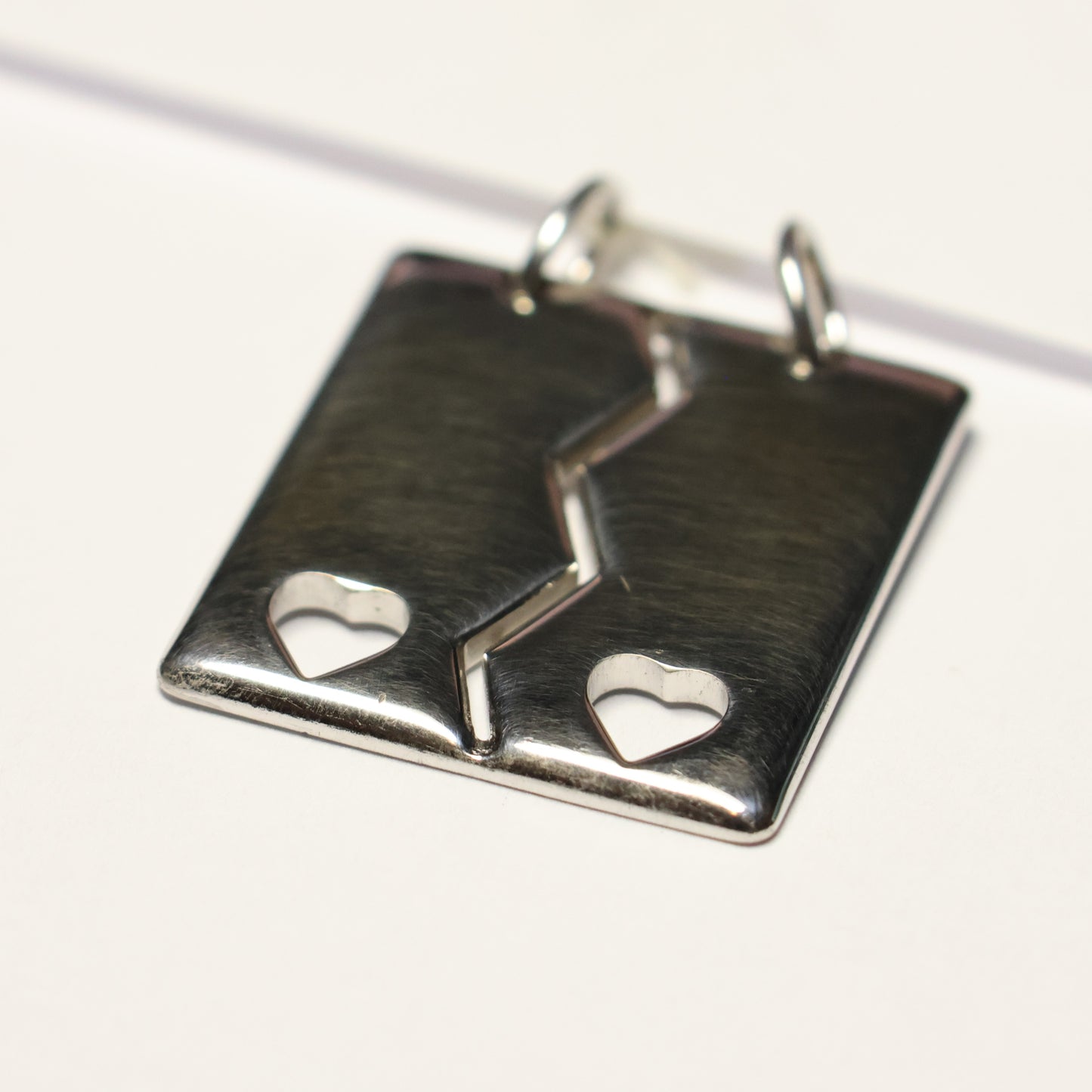 Tresor zilveren hanger breekvierkant glans hartjes B143