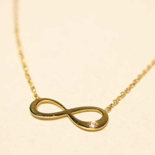 Ketting geel goud met infinity tussenstuk met briljant 056972A