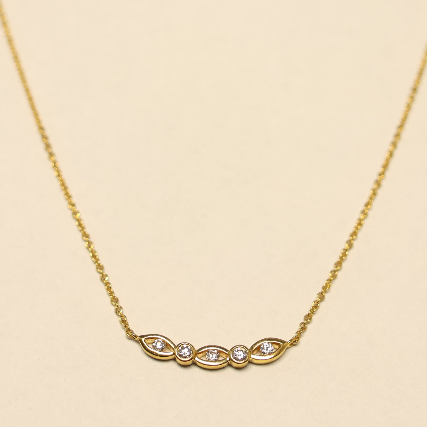 Geelgouden ketting briljant oogjes charm 063625A