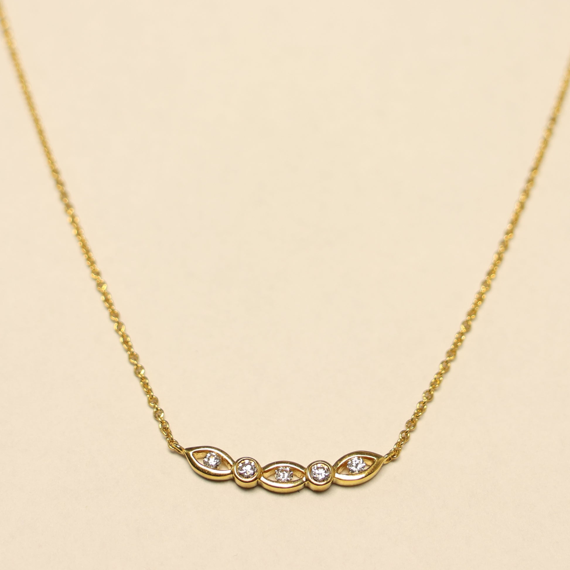 Geelgouden ketting briljant oogjes charm 063625A